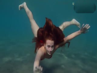 Super sexy bikini girl snorkels under the sea